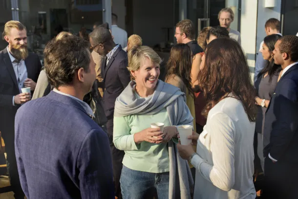 group of people talking, relaxed, outside 