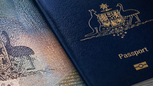 Close-up of an Australian passport, showcasing its blue cover and gold detailing.